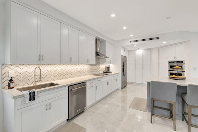 800 Andrews Ave Unit 9, Delray Beach, FL 33483 - kitchen with marble finish floor, a sink, backsplash, wall chimney range hood, and appliances with stainless steel finishes