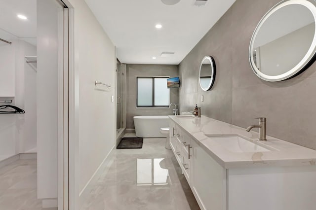 800 Andrews Ave Unit 9, Delray Beach, FL 33483 - full bathroom featuring a stall shower, marble finish floor, a sink, a soaking tub, and double vanity