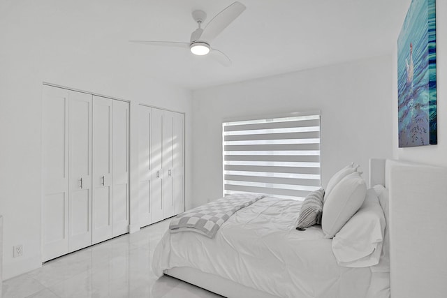 800 Andrews Ave Unit 9, Delray Beach, FL 33483 - bedroom featuring two closets, a ceiling fan, and light tile patterned floors