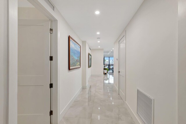 800 Andrews Ave Unit 9, Delray Beach, FL 33483 - corridor featuring baseboards, recessed lighting, marble finish floor, and visible vents