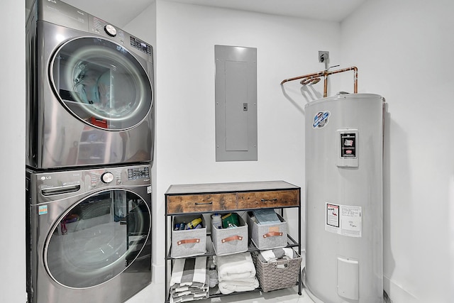 800 Andrews Ave Unit 9, Delray Beach, FL 33483 - laundry room with laundry area, stacked washer and clothes dryer, electric panel, and water heater