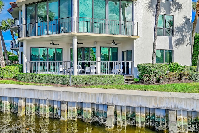 800 Andrews Ave Unit 9, Delray Beach, FL 33483 - back of house with a balcony, stucco siding, ceiling fan, and a water view