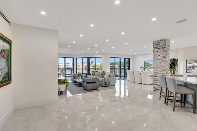 800 Andrews Ave Unit 9, Delray Beach, FL 33483 - living room featuring visible vents, marble finish floor, ornate columns, and recessed lighting