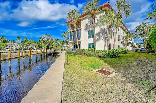 800 Andrews Ave Unit 9, Delray Beach, FL 33483 - dock area with a water view and a lawn