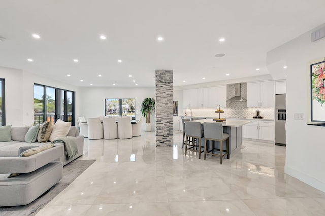 800 Andrews Ave Unit 9, Delray Beach, FL 33483 - living room with visible vents, marble finish floor, ornate columns, and recessed lighting