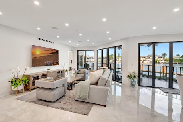 800 Andrews Ave Unit 9, Delray Beach, FL 33483 - living area with light marble finish flooring, recessed lighting, a water view, and baseboards