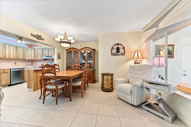 dining space with ceiling fan with notable chandelier, a textured ceiling, and light tile patterned flooring