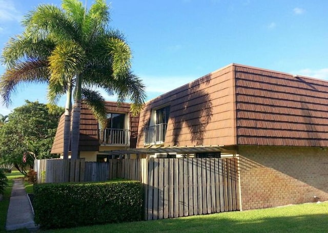 view of home's exterior featuring a balcony