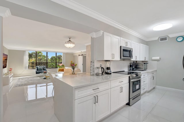 kitchen with crown molding, stainless steel appliances, decorative backsplash, and white cabinets