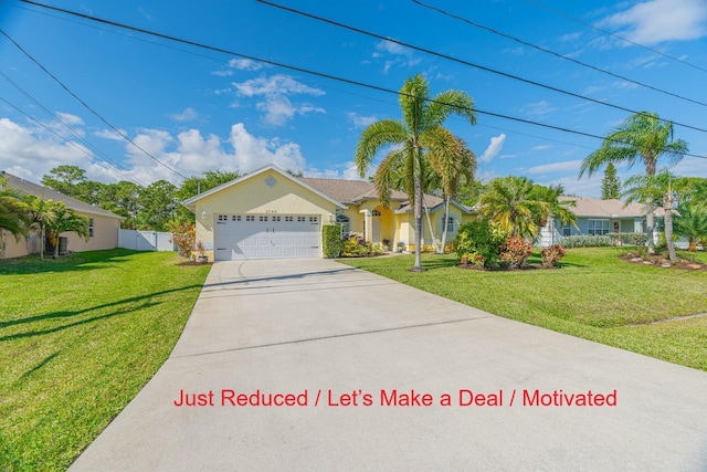 single story home featuring a front yard, fence, driveway, stucco siding, and a garage