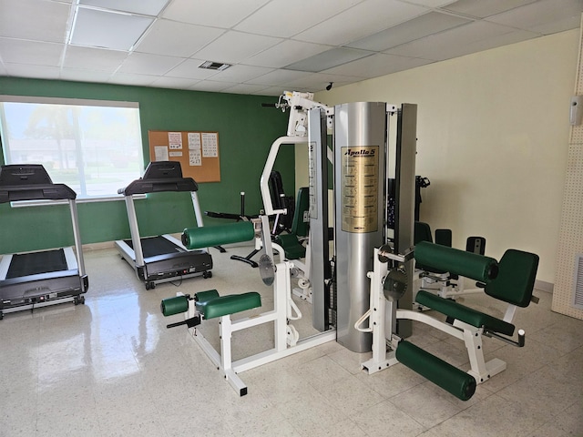 gym featuring a drop ceiling