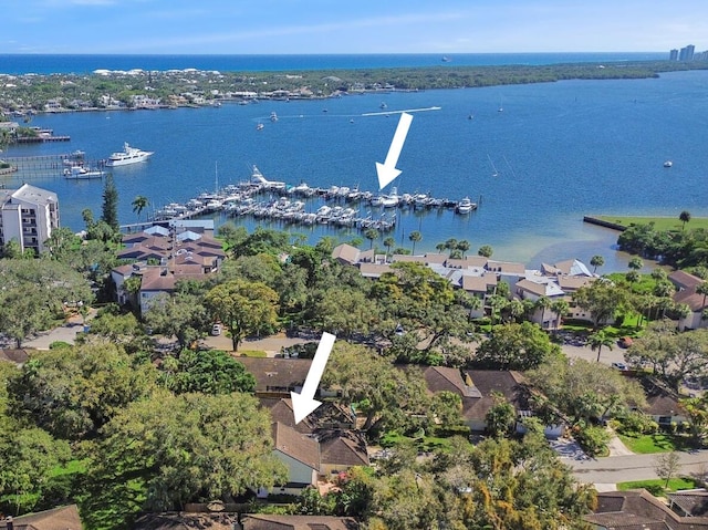 birds eye view of property with a water view