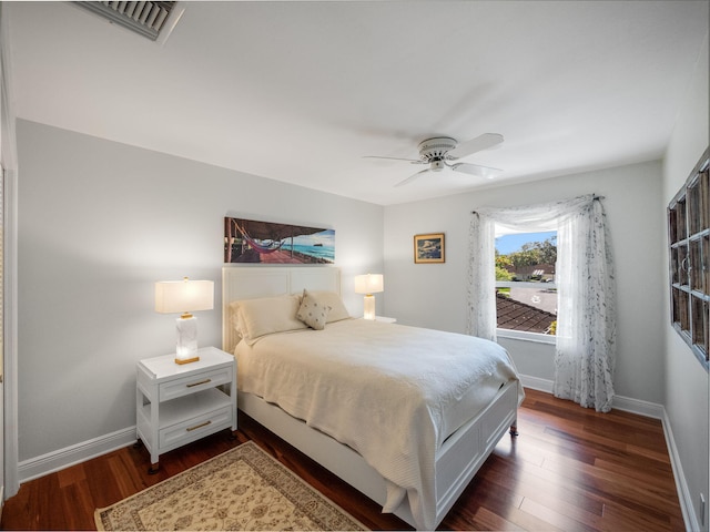 bedroom featuring ceiling fan and dark hardwood / wood-style flooring