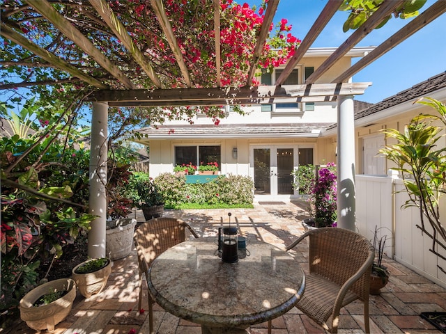 view of patio featuring french doors and a pergola