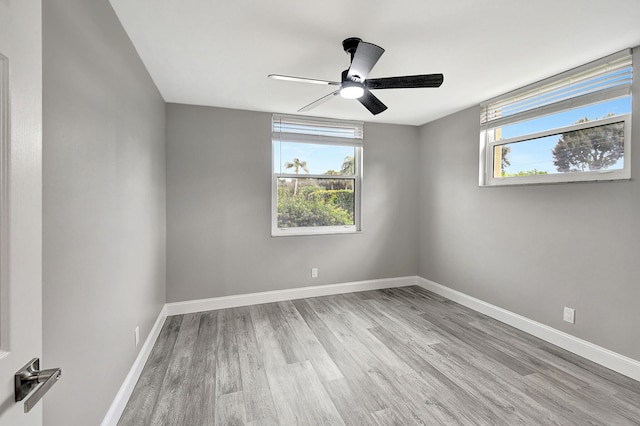 empty room featuring ceiling fan and light wood-type flooring