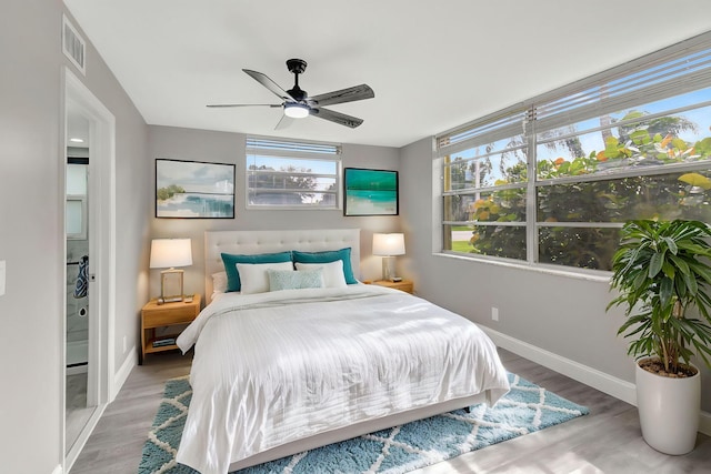 bedroom with wood-type flooring and ceiling fan