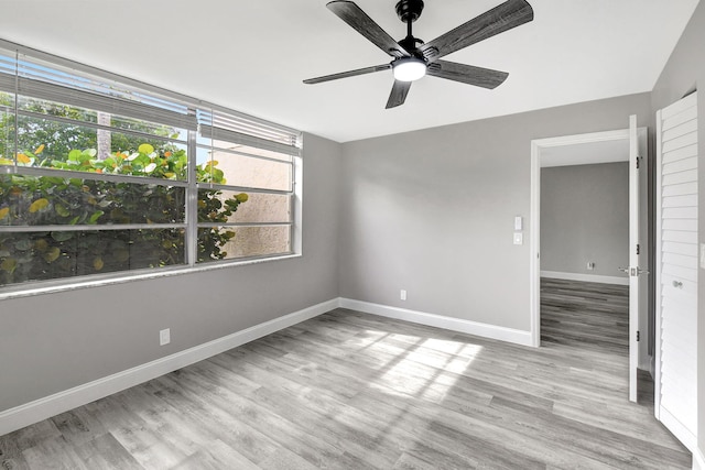 unfurnished room featuring light hardwood / wood-style flooring and ceiling fan