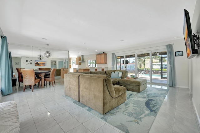 living room featuring light tile patterned flooring and plenty of natural light