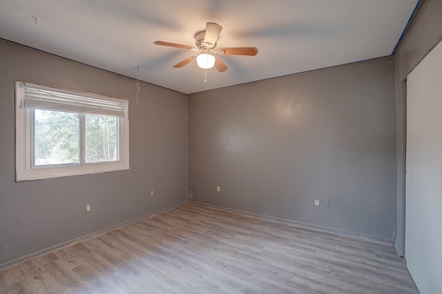 empty room featuring light hardwood / wood-style flooring and ceiling fan