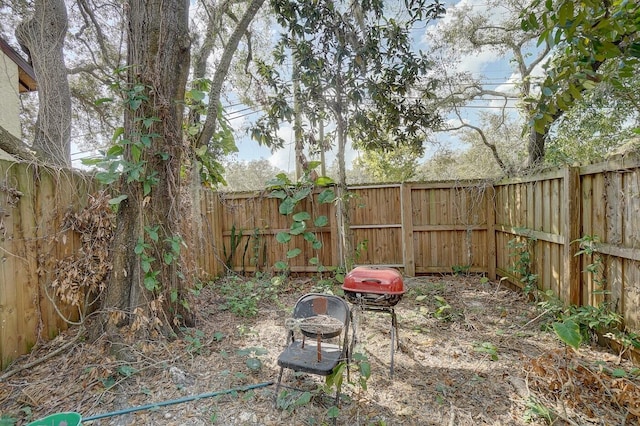 view of yard featuring an outdoor fire pit