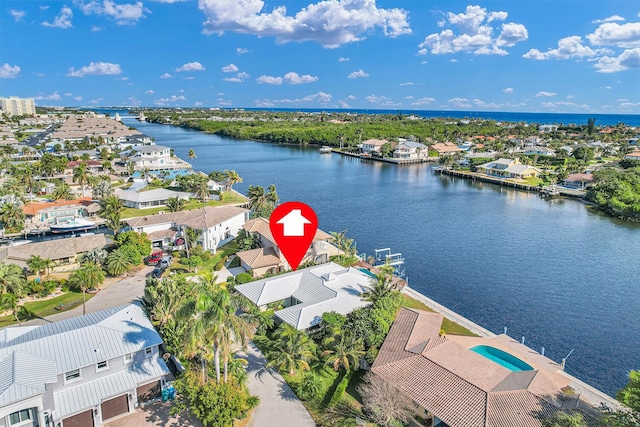 drone / aerial view featuring a residential view and a water view