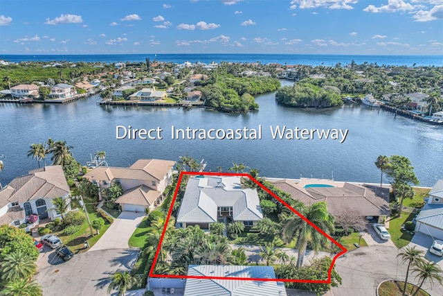 aerial view with a residential view and a water view