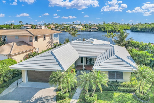 birds eye view of property featuring a residential view and a water view