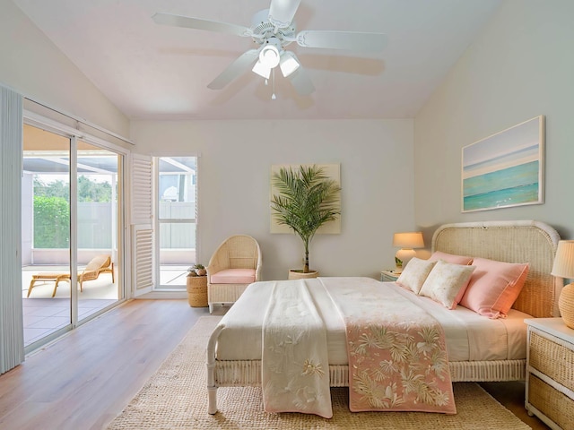 bedroom with lofted ceiling, access to outside, ceiling fan, and wood finished floors