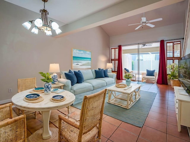 living area featuring light tile patterned floors, ceiling fan with notable chandelier, and vaulted ceiling