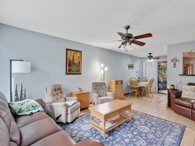 living room featuring a textured ceiling and light tile patterned floors