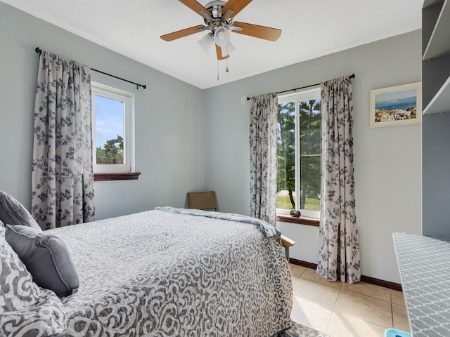 bedroom featuring ceiling fan and light tile patterned floors