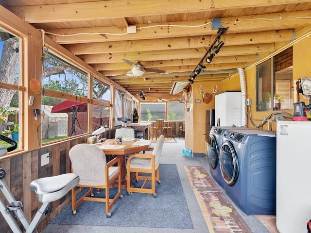 interior space featuring water heater and washer and dryer