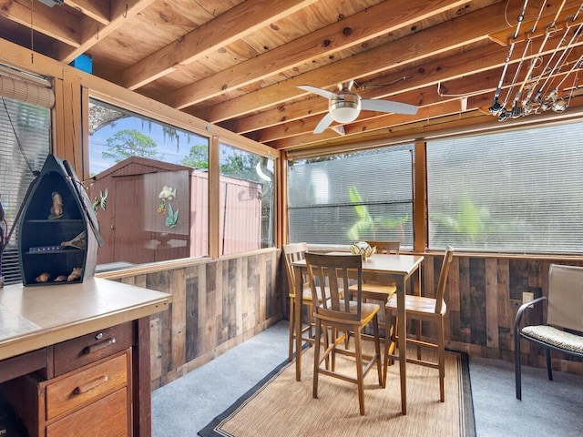 sunroom / solarium featuring ceiling fan