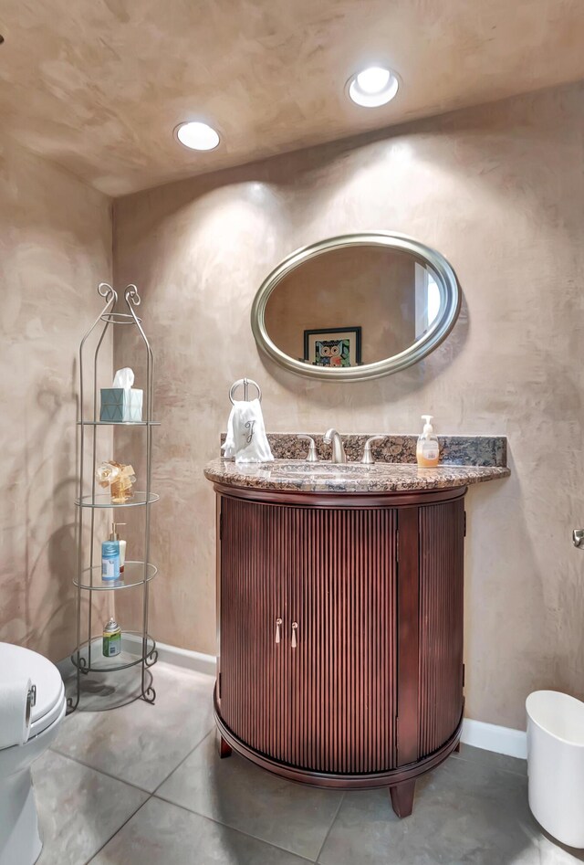 laundry room with light tile patterned flooring, cabinets, washer and dryer, and a textured ceiling