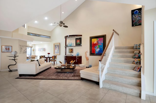 living room featuring light tile patterned flooring, ceiling fan, and high vaulted ceiling