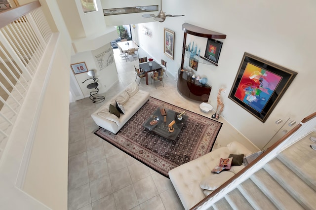 tiled living room featuring ceiling fan