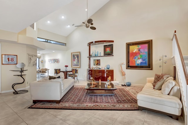 living room featuring light tile patterned flooring, ceiling fan, and high vaulted ceiling