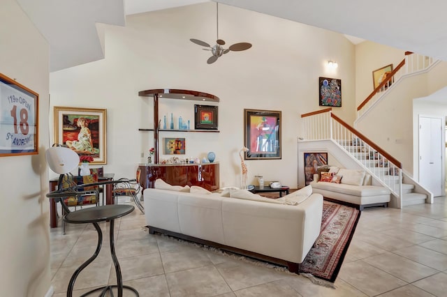 living room featuring light tile patterned floors, high vaulted ceiling, and ceiling fan