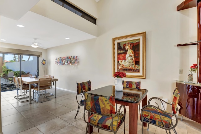 dining room with tile patterned floors and ceiling fan