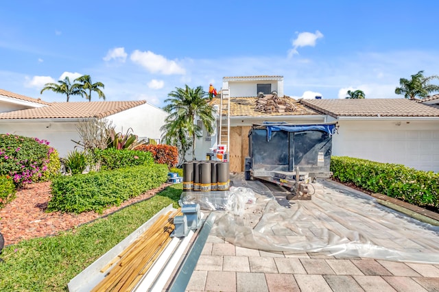 view of patio / terrace featuring a garage