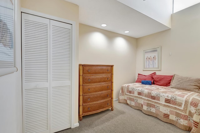 bedroom with carpet floors and a closet