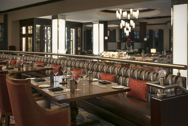 dining space featuring indoor bar