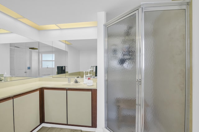 bathroom featuring a stall shower and vanity