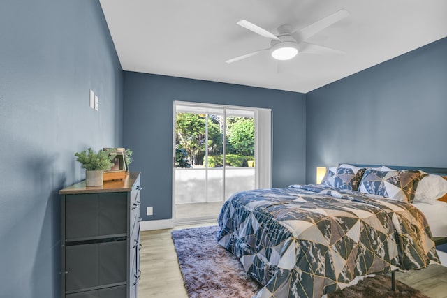 bedroom featuring ceiling fan, baseboards, light wood-style flooring, and access to exterior