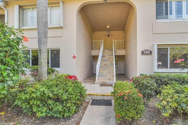 view of exterior entry featuring stucco siding