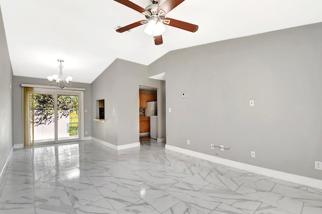 spare room with vaulted ceiling and ceiling fan with notable chandelier