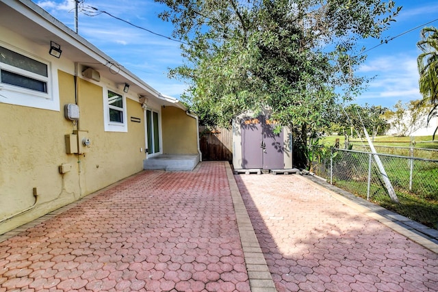 view of patio / terrace with a storage shed