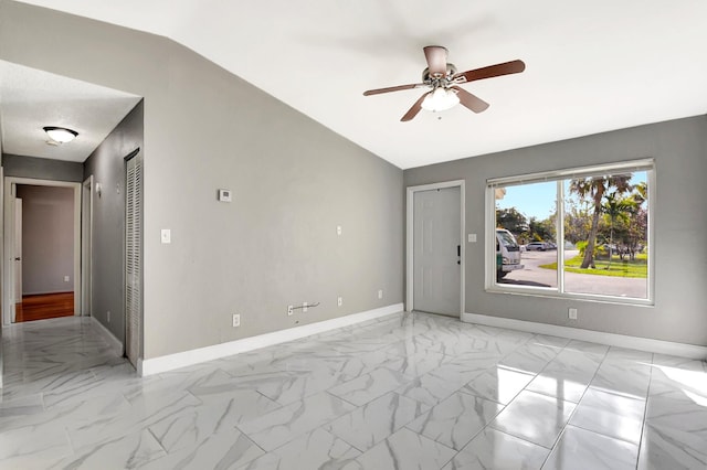 unfurnished room with vaulted ceiling and ceiling fan