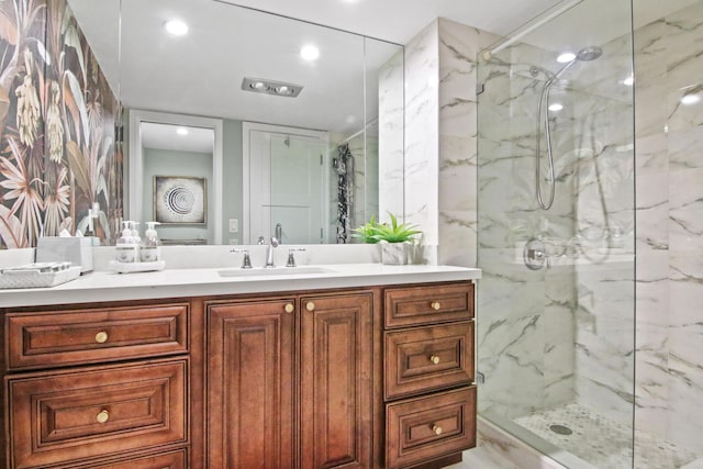 bathroom featuring vanity and a shower with shower door