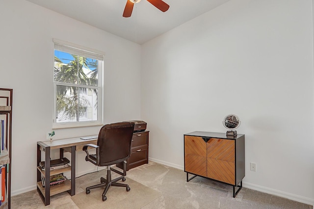 carpeted home office with ceiling fan